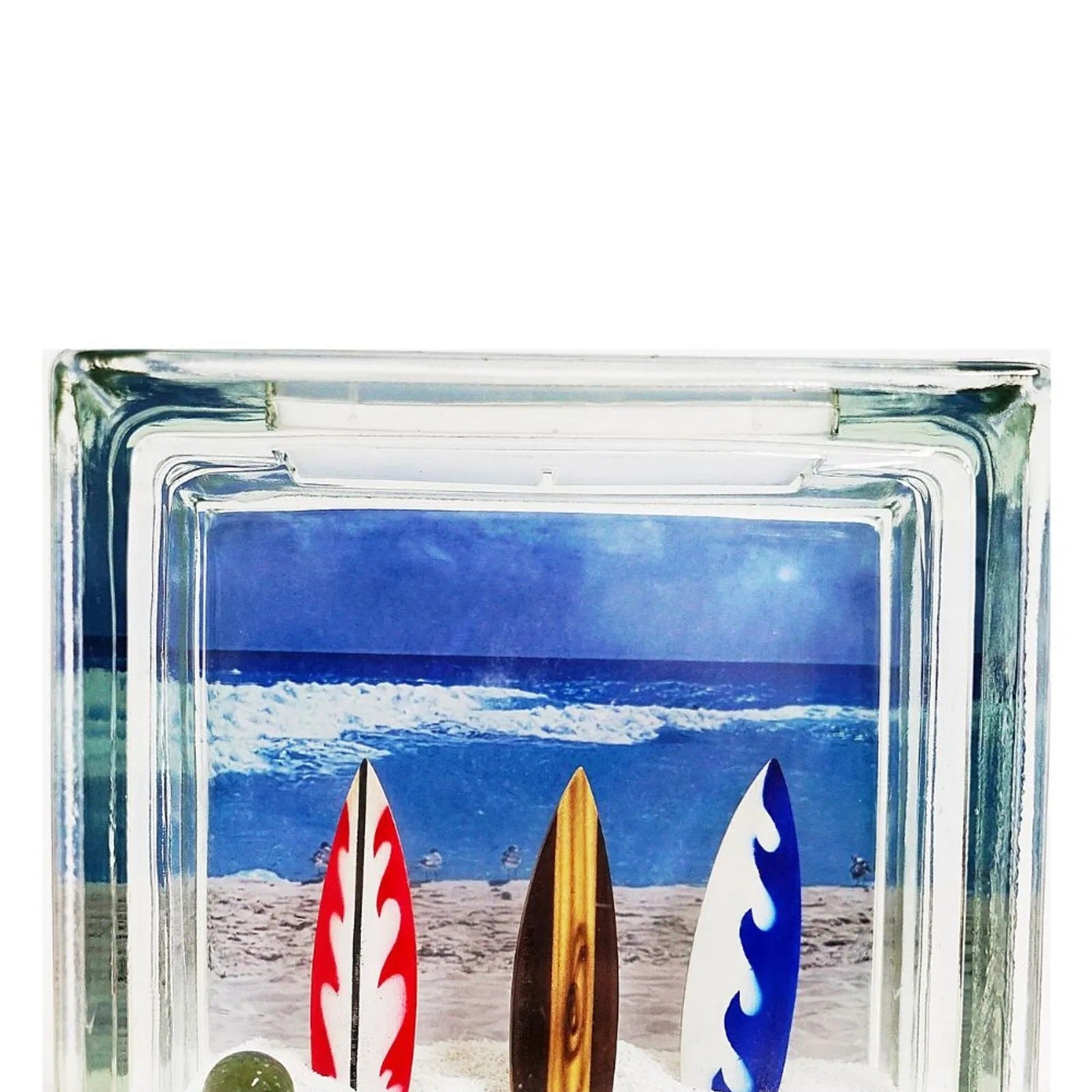 Kit 12 Blocos de Vidro Incolor Tradestar com furo, ideal para divisórias e decoração. Cada bloco possui dimensões de 19x19x8cm, com imagem de praia e pranchas de surf.